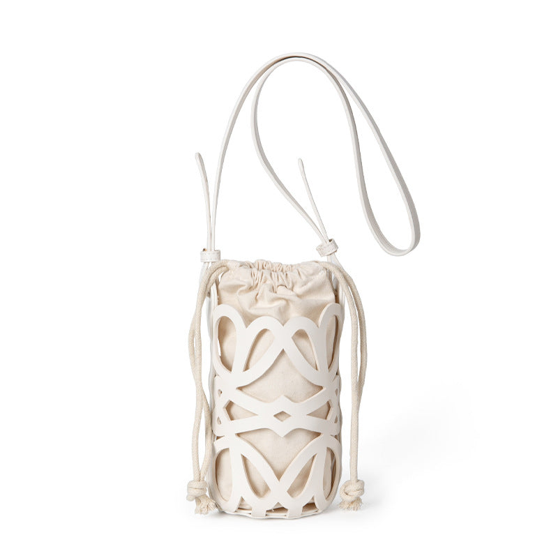 (WD3902) Niche Design Hollow Drawstring Canvas Cylinder Small Bag Personality Retro Crossbody