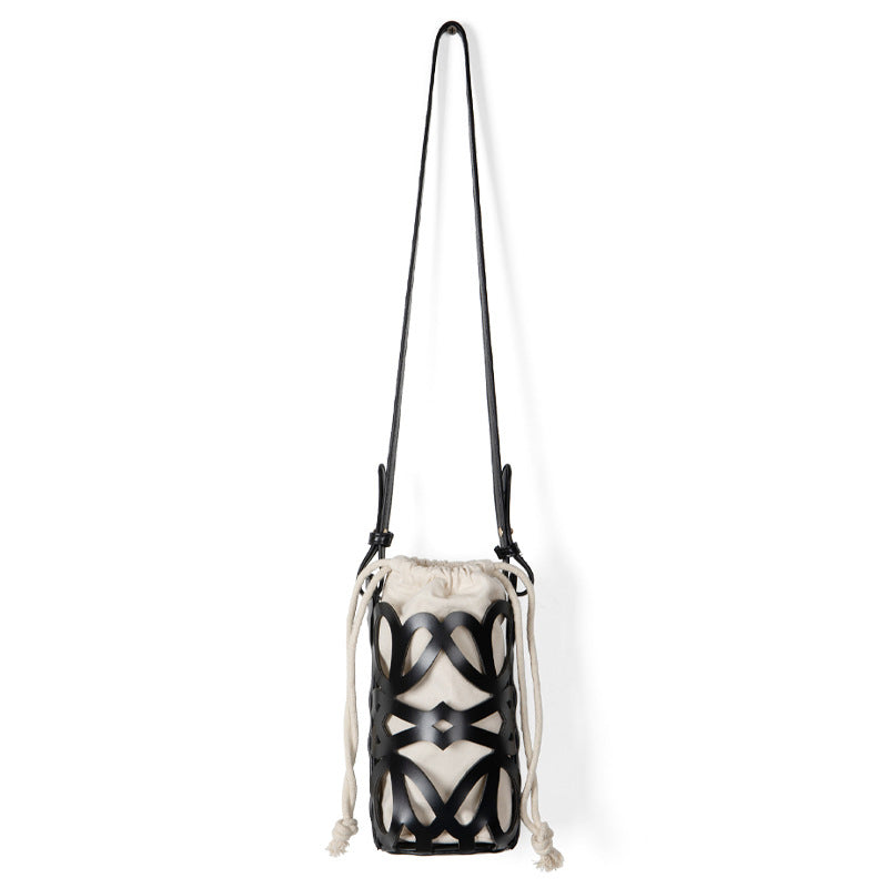 (WD3902) Niche Design Hollow Drawstring Canvas Cylinder Small Bag Personality Retro Crossbody