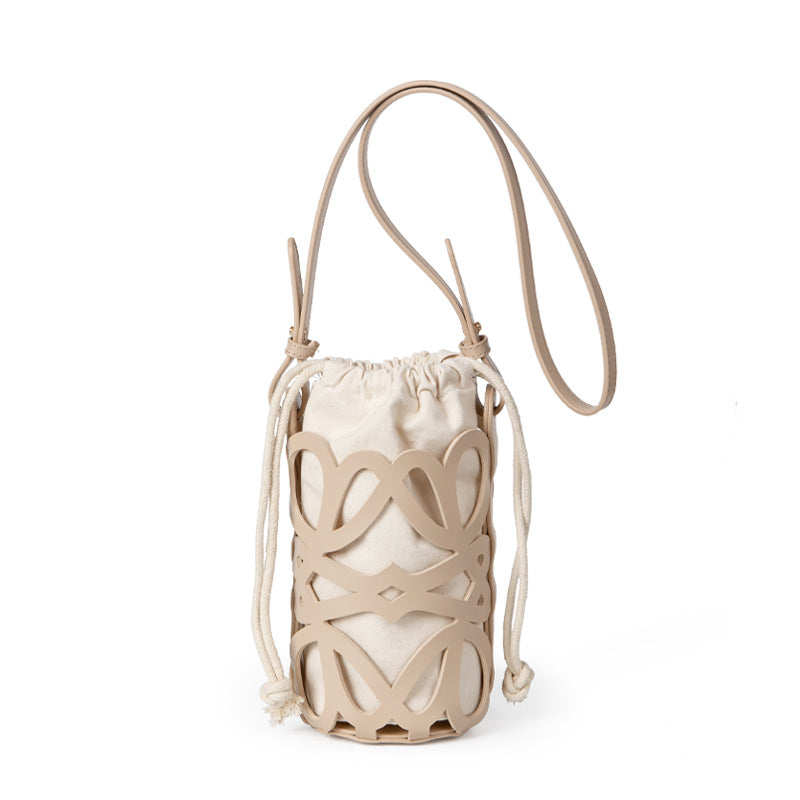 (WD3902) Niche Design Hollow Drawstring Canvas Cylinder Small Bag Personality Retro Crossbody